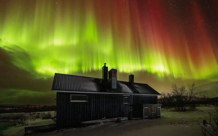 Hut and northern lights, Abisko, Sweden